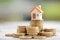 Mini house on stack of coins. Concept of Investment property.; Shutterstock ID 787659988; purchase_order: 131; job: ; client: ; other: 